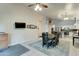 Dining area with dark wood table and kitchen views at 657 N Gregory Pl, Chandler, AZ 85226