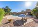 Community pool with patio tables and umbrellas at 7430 N 43Rd Dr, Glendale, AZ 85301