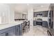 Updated kitchen featuring dark cabinetry and a kitchen island at 7913 W Chickasaw St, Phoenix, AZ 85043