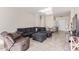 Open living room with tile floors, comfortable seating and natural light at 7913 W Chickasaw St, Phoenix, AZ 85043