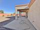 Covered patio with ceiling fan and access to the backyard at 11100 W Magdalena Dr, Arizona City, AZ 85123