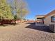 Backyard with covered patio and gravel at 11100 W Magdalena Dr, Arizona City, AZ 85123