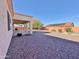 Large backyard with covered patio and gravel at 11100 W Magdalena Dr, Arizona City, AZ 85123