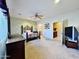 Comfortable bedroom with ensuite bathroom access and ceiling fan at 11100 W Magdalena Dr, Arizona City, AZ 85123