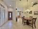 Spacious entryway with tile flooring and views into the dining and kitchen areas at 11100 W Magdalena Dr, Arizona City, AZ 85123