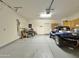 Spacious garage with overhead storage and a dune buggy at 11100 W Magdalena Dr, Arizona City, AZ 85123