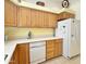 Kitchen boasts ample counter space and wood cabinets at 11100 W Magdalena Dr, Arizona City, AZ 85123