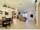 Open living and dining area with tile floors, a fireplace, and a ceiling fan at 11100 W Magdalena Dr, Arizona City, AZ 85123