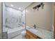 Modern bathroom with marble tile and granite vanity at 115 Ironwood Pl, Wickenburg, AZ 85390