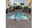 Community pool with brick patio and covered seating area at 1406 W Main St # 140, Mesa, AZ 85201