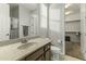 Bathroom with granite countertop, toilet and walk-in shower at 14575 W Orange Dr, Litchfield Park, AZ 85340