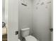 Small powder room with toilet and decorative accents at 14575 W Orange Dr, Litchfield Park, AZ 85340