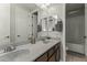 Bathroom boasts double vanity and shower/tub combo at 14575 W Orange Dr, Litchfield Park, AZ 85340