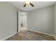 Light and airy bedroom with wood-look floors and access to the bathroom at 14575 W Orange Dr, Litchfield Park, AZ 85340