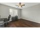 Home office with wood floors and built-in shelving at 14575 W Orange Dr, Litchfield Park, AZ 85340