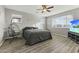 Bright bedroom with comfy bed and hanging chair at 14575 W Orange Dr, Litchfield Park, AZ 85340