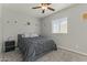 Charming bedroom with a queen-size bed and unicorn decor at 14575 W Orange Dr, Litchfield Park, AZ 85340