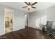 Bedroom with wood floors, ceiling fan and walk-in closet at 14575 W Orange Dr, Litchfield Park, AZ 85340
