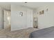 Bright bedroom featuring a full-size bed and mirrored closet at 14575 W Orange Dr, Litchfield Park, AZ 85340