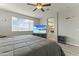 Main bedroom with large bed, en-suite bathroom view at 14575 W Orange Dr, Litchfield Park, AZ 85340