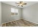 Spacious bedroom with wood-look floors and ceiling fan at 14575 W Orange Dr, Litchfield Park, AZ 85340