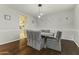 Bright dining room features hardwood floors and a casual dining table at 14575 W Orange Dr, Litchfield Park, AZ 85340