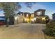 Two-story house with a three-car garage and landscaped front yard at dusk at 14575 W Orange Dr, Litchfield Park, AZ 85340