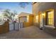 Front entrance with a brick walkway and wrought iron gate at 14575 W Orange Dr, Litchfield Park, AZ 85340