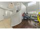 Game room with arcade games and a curved staircase at 14575 W Orange Dr, Litchfield Park, AZ 85340