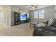 Fun game room with large TV, comfy couch, and beanbag chair at 14575 W Orange Dr, Litchfield Park, AZ 85340