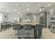 Island kitchen with granite countertops and gray cabinets at 14575 W Orange Dr, Litchfield Park, AZ 85340