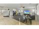 Living room with a large TV and comfortable seating at 14575 W Orange Dr, Litchfield Park, AZ 85340