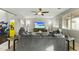 Open living room with comfortable seating and large TV at 14575 W Orange Dr, Litchfield Park, AZ 85340