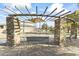 Community playground with climbing structures, shaded area, and benches at 14575 W Orange Dr, Litchfield Park, AZ 85340