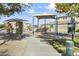 Community playground with play structures and shaded area at 14575 W Orange Dr, Litchfield Park, AZ 85340
