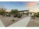 Community pool area with a pergola and landscaping at 14575 W Orange Dr, Litchfield Park, AZ 85340