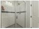 Clean shower with subway tile and glass enclosure at 14575 W Orange Dr, Litchfield Park, AZ 85340