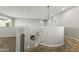 Upstairs landing with carpeted floors and curved staircase at 14575 W Orange Dr, Litchfield Park, AZ 85340