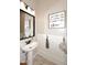 Small bathroom with a pedestal sink and decorative wall at 14820 W Adeline Way, Surprise, AZ 85379