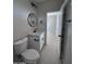 Modern bathroom with white vanity and round mirror at 15494 S Kline Pl, Arizona City, AZ 85123