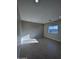 Bright bedroom with tile floors and a window at 15494 S Kline Pl, Arizona City, AZ 85123