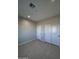 Spacious bedroom with double closets and neutral decor at 15494 S Kline Pl, Arizona City, AZ 85123