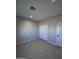 Bright bedroom with double door closet and neutral walls at 15494 S Kline Pl, Arizona City, AZ 85123