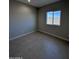Well-lit bedroom with neutral walls and tile flooring at 15494 S Kline Pl, Arizona City, AZ 85123