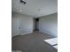 Large bedroom with tile floors and access to other rooms at 15494 S Kline Pl, Arizona City, AZ 85123