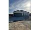 Tan house with a two-car garage and dark trim at 15494 S Kline Pl, Arizona City, AZ 85123