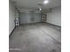 Attached garage with overhead door and storage shelves at 15494 S Kline Pl, Arizona City, AZ 85123