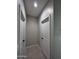 Bright hallway with two closed doors at 15494 S Kline Pl, Arizona City, AZ 85123