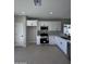 Modern kitchen with white cabinets and stainless steel appliances at 15494 S Kline Pl, Arizona City, AZ 85123