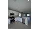 Modern kitchen with white cabinets and stainless steel appliances at 15494 S Kline Pl, Arizona City, AZ 85123